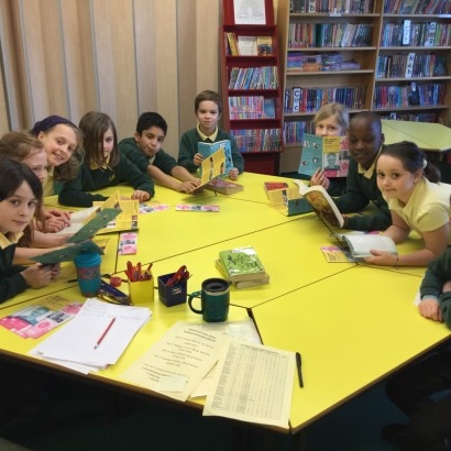 Primary children working round a table