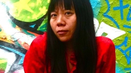 Chinese author and film=maker Xiaolu Guo in a bright red top.