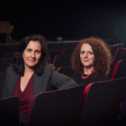 Authors Kamila Shamsie and Maggie O'Farrell sat in the theatre at HOME with the stage lights behind them